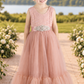 blush flower girl dress in a full mermaid style skirt in sleeveless lace and tulle bottom. 