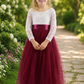 burgundy flower girl dress in tulle and lace. Long sleeve white lace with a full length tulle skirt. 