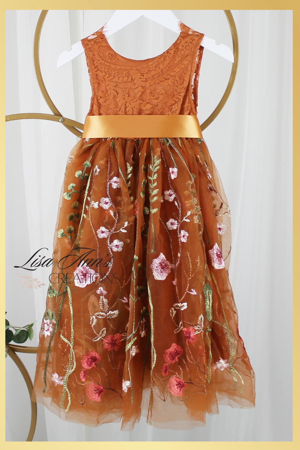 Burnt orange floral embroidery girls' dress. Sleeveless lace sleeves with a floral full length style. perfect for flower girls and special occasions. sizes for babies, toddlers and preteens. 