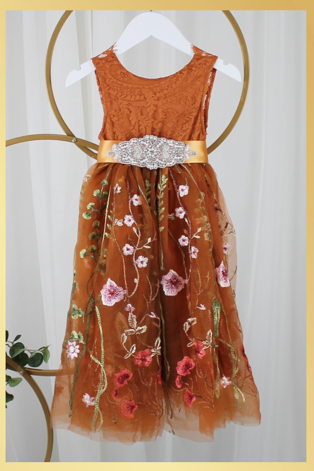 Burnt orange floral embroidery girls' dress. Sleeveless lace sleeves with a floral full length style. perfect for flower girls and special occasions. sizes for babies, toddlers and preteens. 