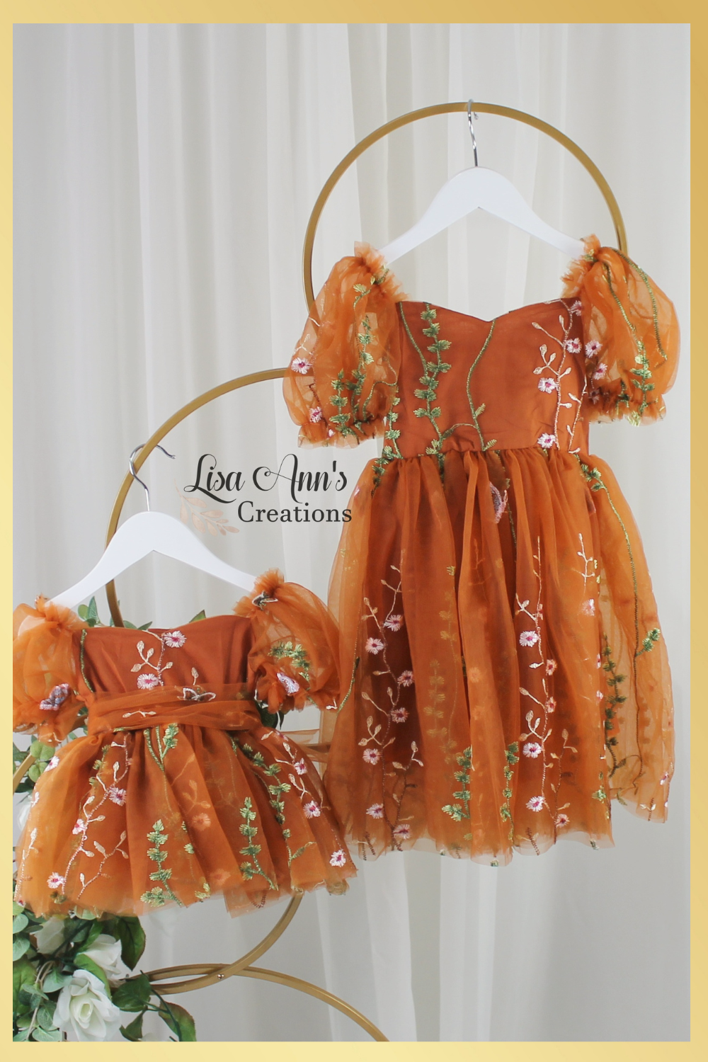 Matching sister dresses in burnt orange floral