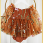 Fall Floral baby girl dress in burnt orange floral embroidery with long tulle sleeves and knee length style and built in bodysuit. 