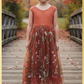 Burnt orange floral embroidery girls' dress. Sleeveless lace sleeves with a floral full length style. perfect for flower girls and special occasions. sizes for babies, toddlers and preteens. 