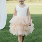 Champagne flower girl dress in a tutu style. With white sleeveless lace top. 