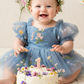 Wildflower first birthday baby girl dress in dusty blue embroidered flowers. 