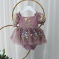 Baby Girl first birthday dress in dusty purple floral embroidery flowers for fairy and wildflower birthday parties. 