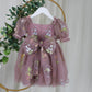 Baby Girl first birthday dress in dusty purple floral embroidery flowers for fairy and wildflower birthday parties. 