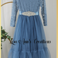 Girls Christmas dress in a dusty blue lace and tulle. Mermaid full length style and long sleeves.