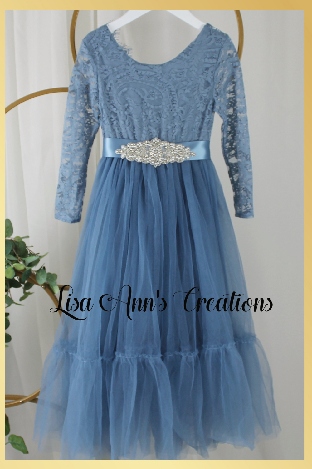 Girls Christmas dress in a dusty blue lace and tulle. Mermaid full length style and long sleeves.