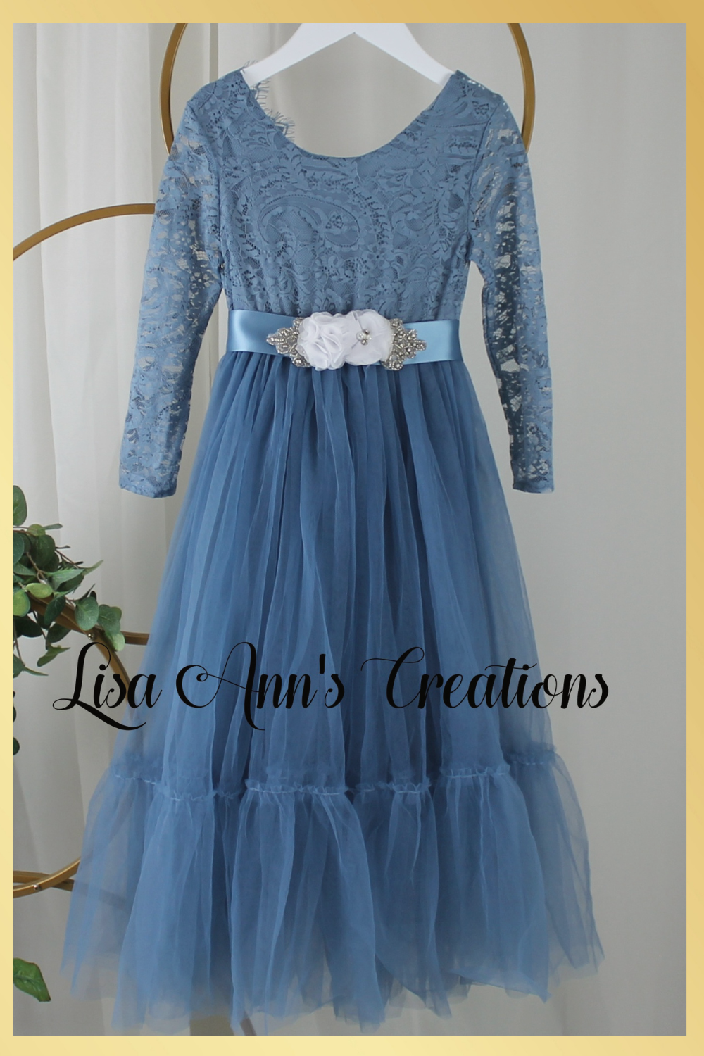 Girls Christmas dress in a dusty blue lace and tulle. Mermaid full length style and long sleeves.