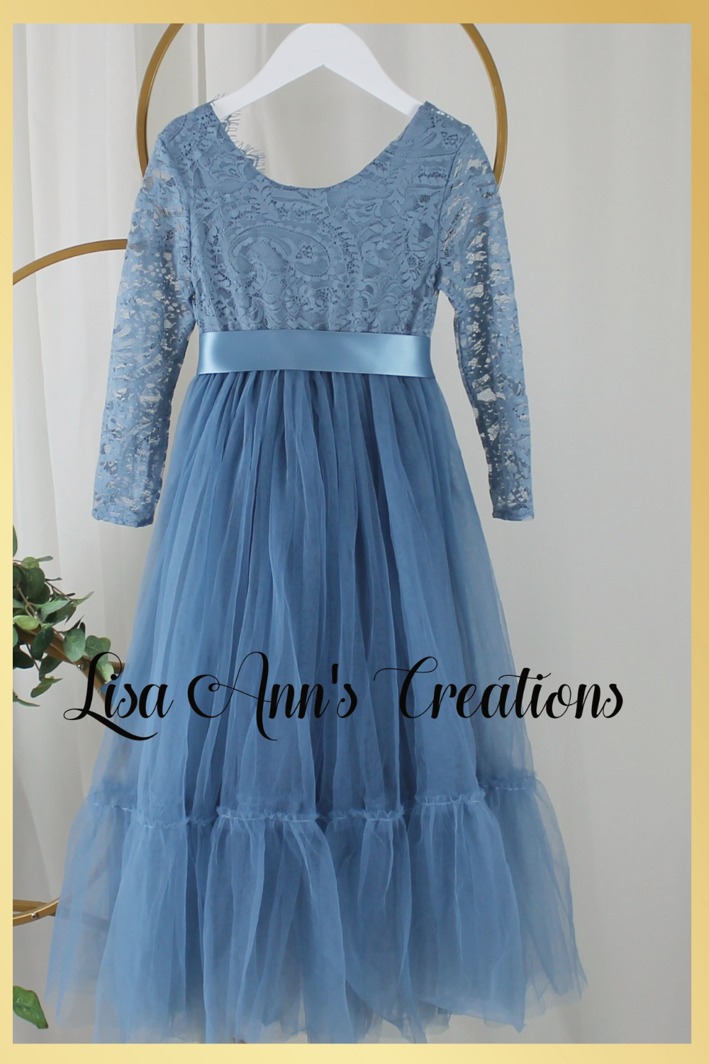 Girls Christmas dress in a dusty blue lace and tulle. Mermaid full length style and long sleeves.