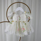 Fairy First birthday baby girls romper dress in ivory floral with wings. 
