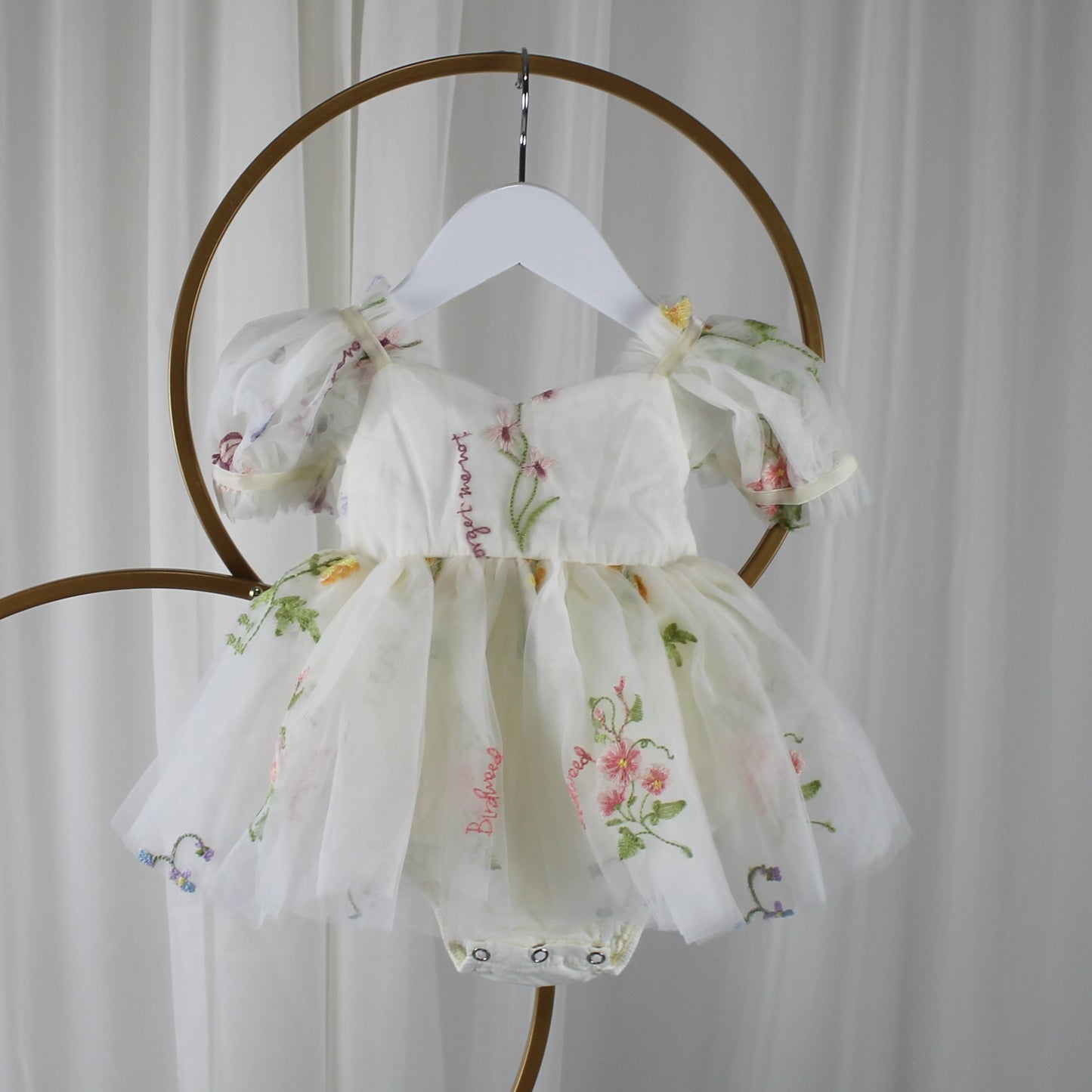 Fairy First birthday baby girls romper dress in ivory floral with wings. 