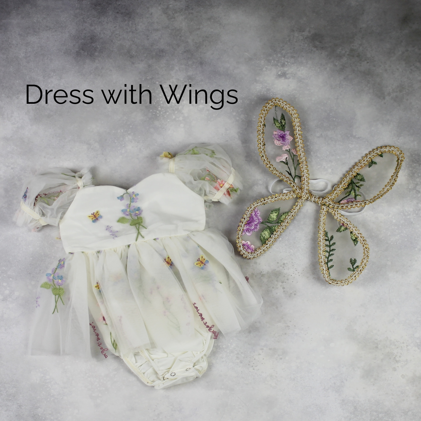 Fairy First birthday baby girls romper dress in ivory floral with wings. 