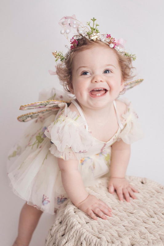 Wildflower first birthday baby girl dress in ivory embroidered flowers. 