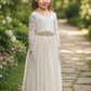 Flower Girl Dress in ivory with long lace sleeves, V-shaped lace back, tulle skirt and ivory sash