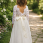 Flower Girl Dress in ivory tulle with white long lace sleeves, V-shaped lace back, tulle skirt and ivory sash
