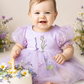Wildflower first birthday baby girl dress in lavender embroidered flowers. 