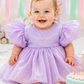 first birthday baby girl dress in lavender romper style. 