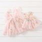 Baby girl first birthday fairy dress in light pink florals.