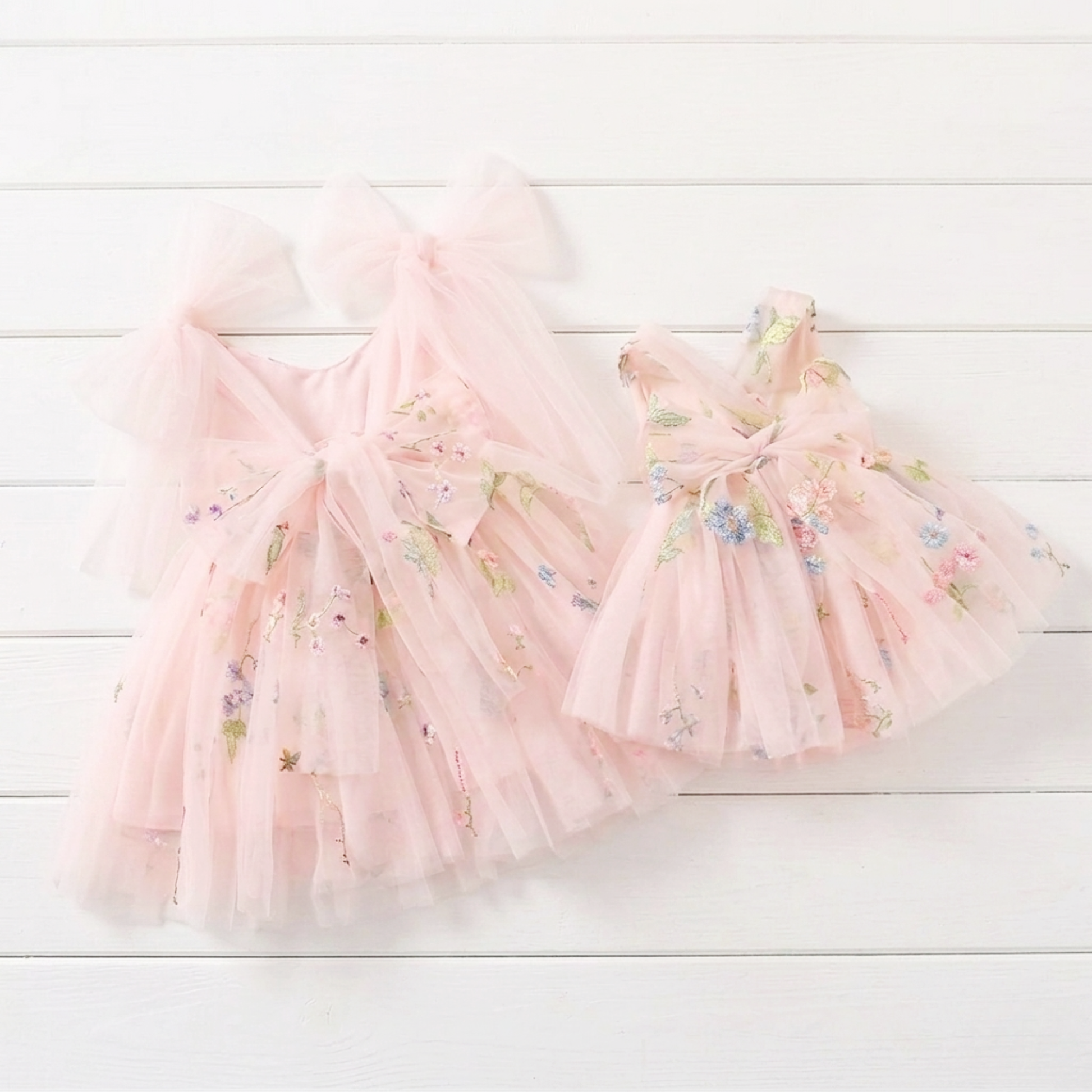 Baby girl first birthday fairy dress in light pink florals.