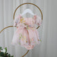 1st birthday baby girl romper in light pink floral for a fairy or garden party theme. 