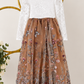 flower girl dress in burnt orange embroidered florals, sequins and tulle. Long sleeve white lace bodice and full length dress.  