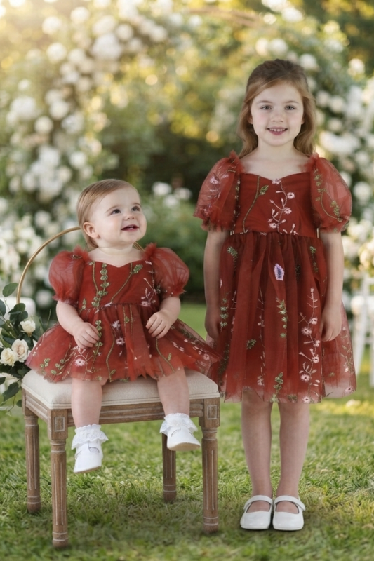 Flower girl dress in rust floral embroidery tulle with puffy sleeves and big bow. 