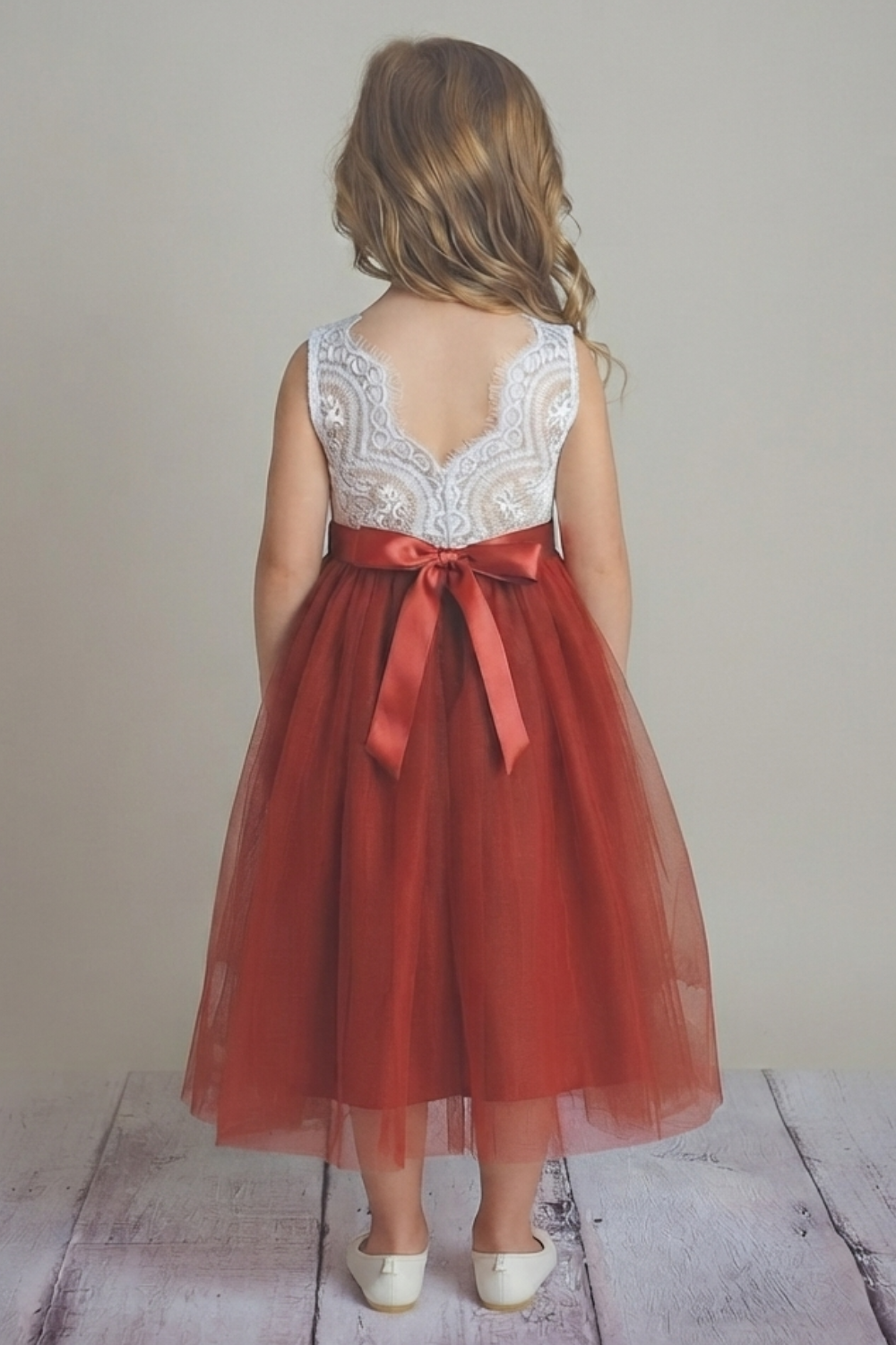 Toddler flower girl in rust tulle and white sleeveless lace