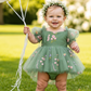 Wildflower first birthday baby girl dress in sage green embroidered flowers. 