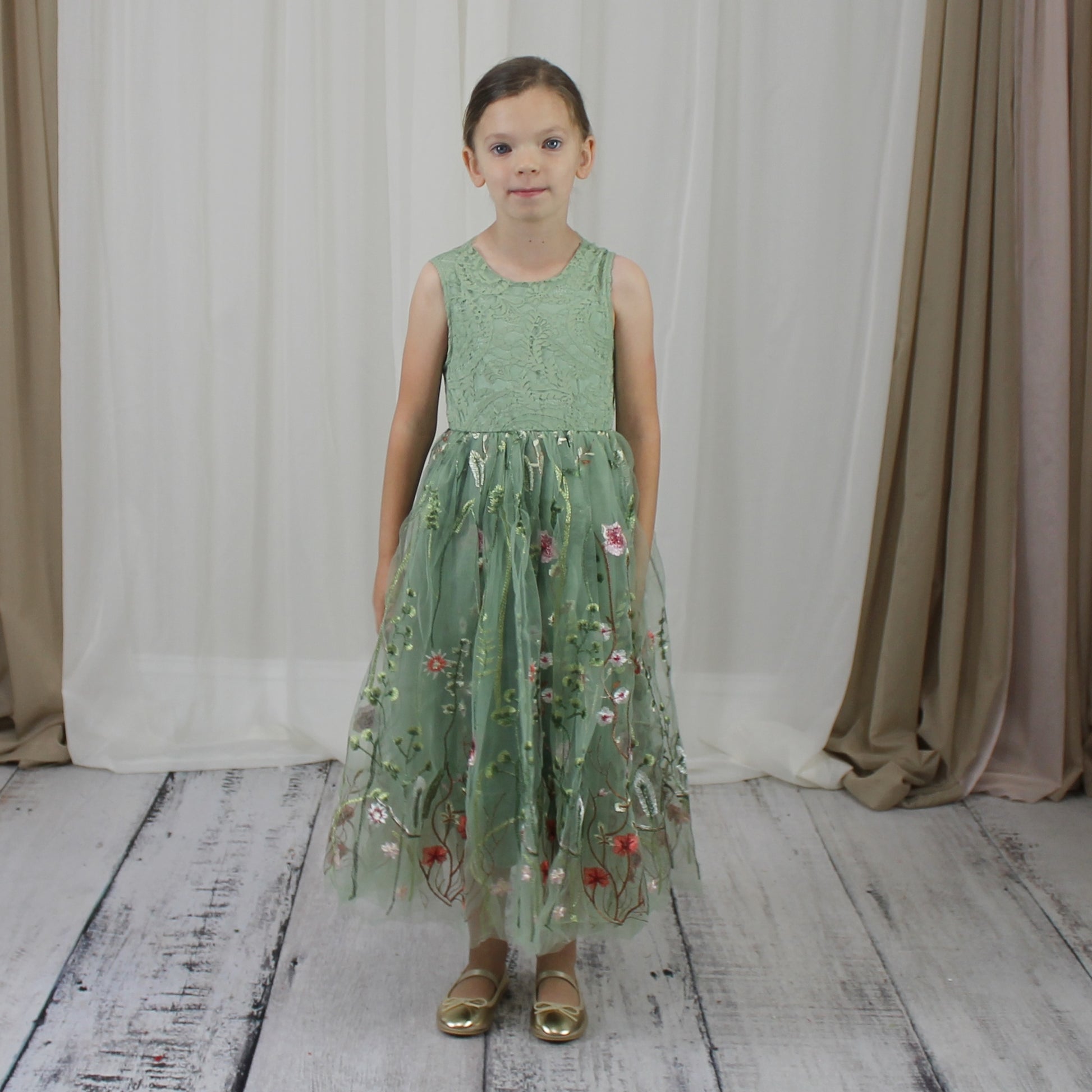 Floral flower girl dress in sage green lace and tulle. Full length dress that is sleeveless
