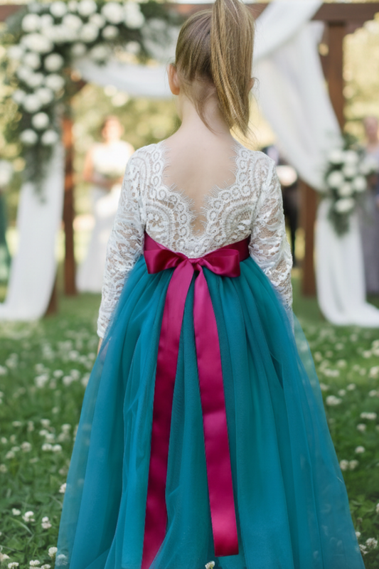 Flower girl dress in teal tulle with long lace white bodice. 