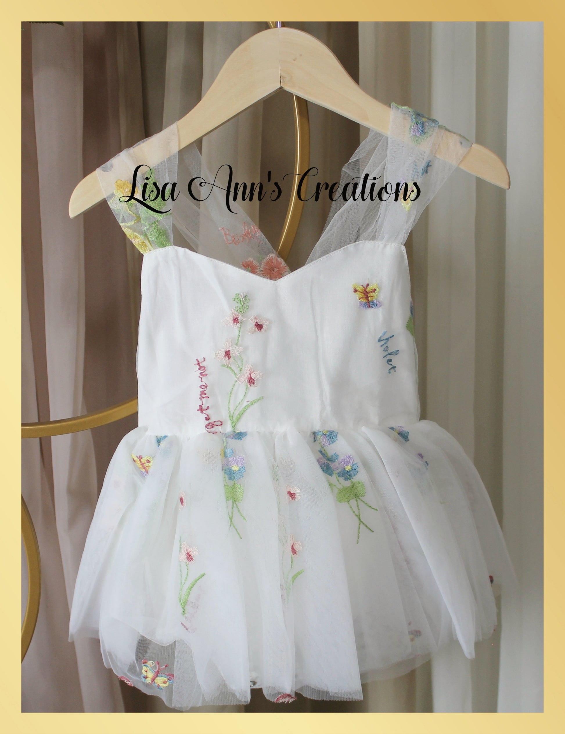 Baby girl first birthday fair dress in white florals.