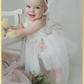 Baby girl first birthday fair dress in white florals.