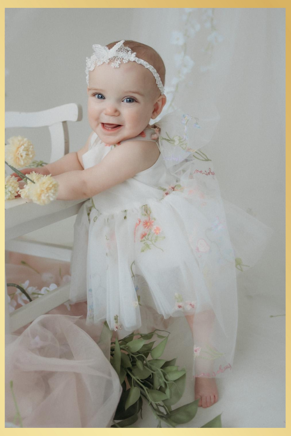 Baby girl first birthday fair dress in white florals.