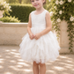 white flower girl dress in a lace and tulle. A tutu tiered style knee length dress with a sleeveless white lace bodice