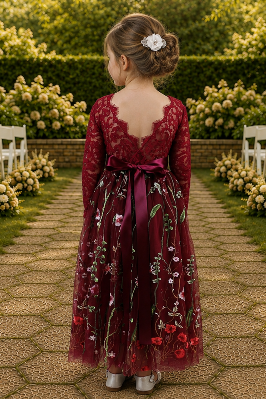 flower girl dress in embroidered floral burgundy tulle. Long lace sleeves and a full length style.