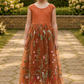 Burnt orange floral embroidery girls' dress. Sleeveless lace sleeves with a floral full length style. perfect for flower girls and special occasions. sizes for babies, toddlers and preteens. 