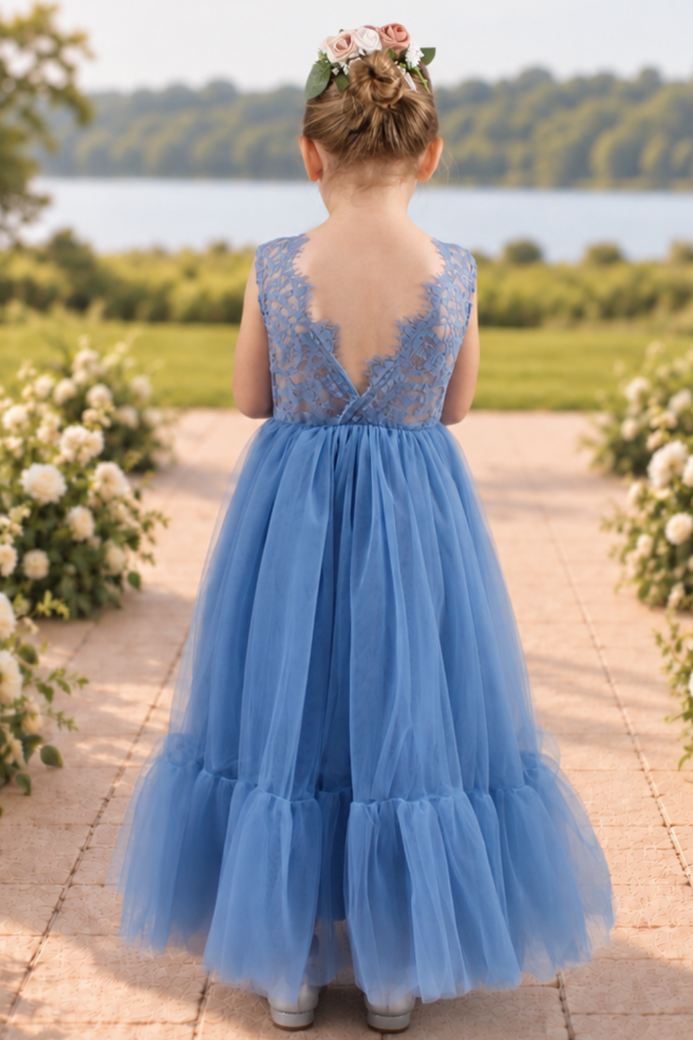dusty blue flower girl dress in tulle and lace. With a mermaid flair bottom in full length.