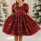 girls Christmas dress in red and green plaid with stars and glitter.  Short puffy sleeves and nee length style dress. 