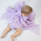 lavender baby girl dress with a large bow and puffy sleeves