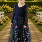 navy blue floral flower girl dress in embroidered floral tulle with long lace sleeves. 