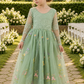 Sage green floral flower girl dress in embroidered tulle. featuring long lace sleeves and full length floral tulle dress. 