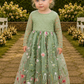 sage flower girl dress in floral tulle with an embroidered floral pattern. Lace long sleeves and a full tulle length. 